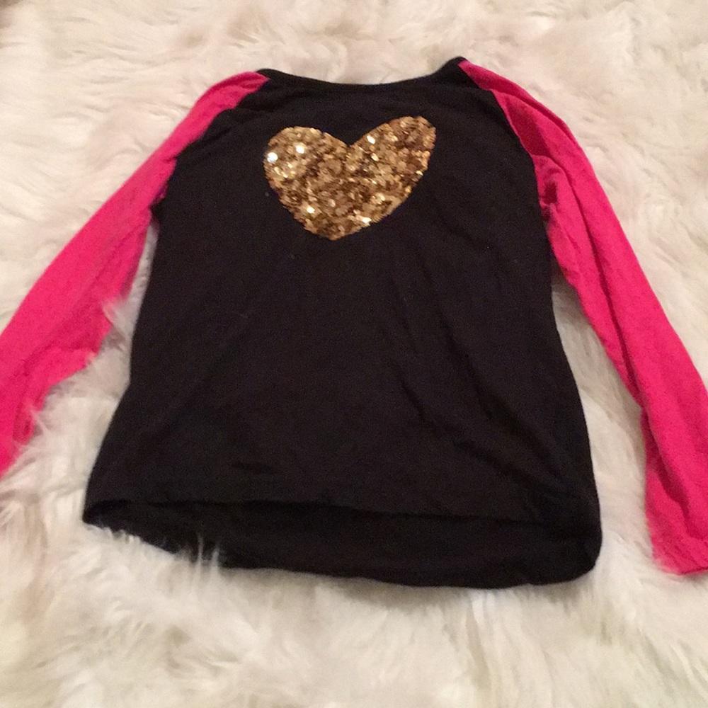 A pink gold and black long sleeve T-shirt